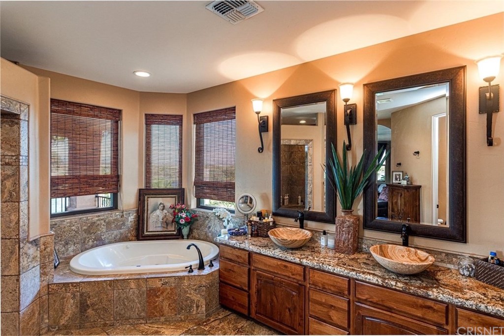 4654 My Place Road Needles, CA 92363 - Photo 28 of 75 a spacious bathroom with sink and mirror