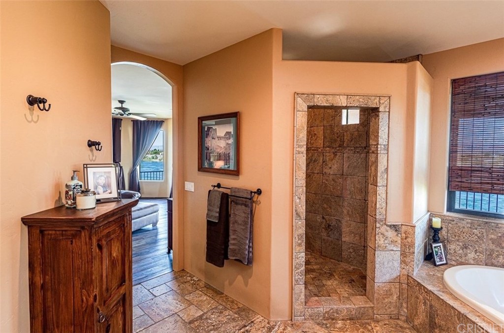 4654 My Place Road Needles, CA 92363 - Photo 29 of 75 a spacious bathroom with a granite countertop sink a mirror and shower