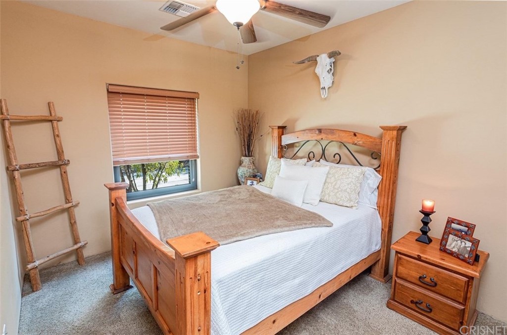 4654 My Place Road Needles, CA 92363 - Photo 33 of 75 a bedroom with a bed and a dresser