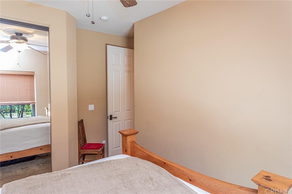 4654 My Place Road Needles, CA 92363 - Photo 34 of 75 a bedroom with a bed and a window