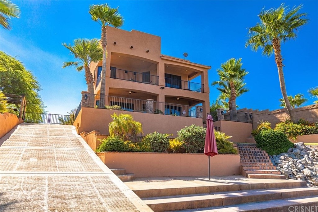 4654 My Place Road Needles, CA 92363 - Photo 4 of 75 a front view of a house with a yard and garage