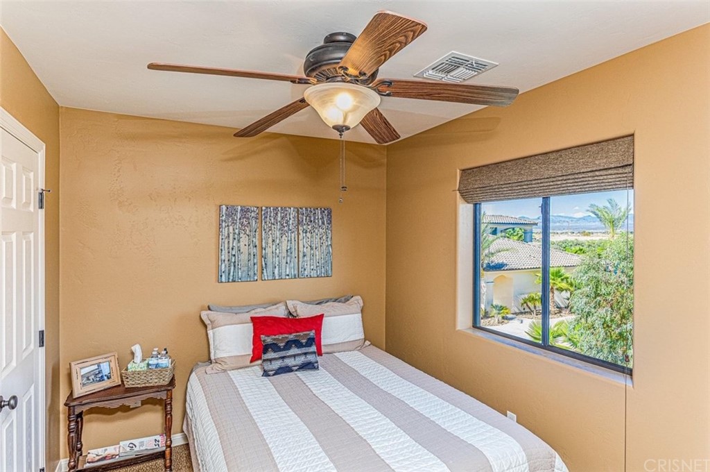 4654 My Place Road Needles, CA 92363 - Photo 50 of 75 a bedroom with a bed and a window