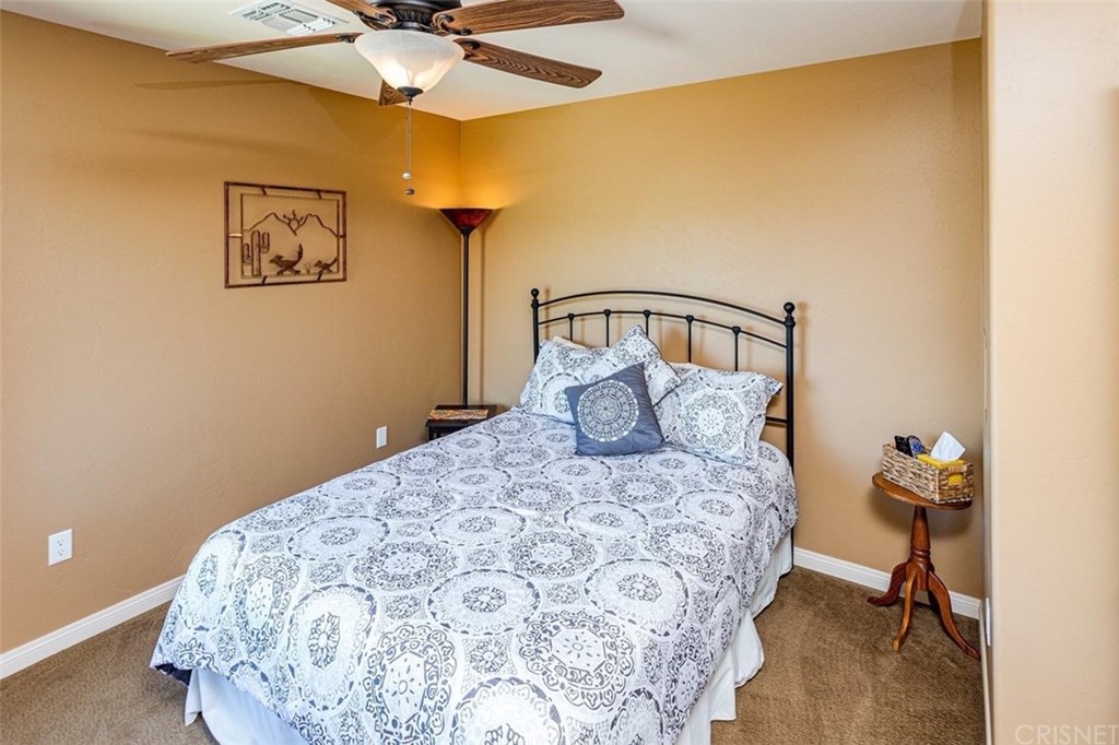 4654 My Place Road Needles, CA 92363 - Photo 52 of 75 a bed sitting in a bedroom next to a window