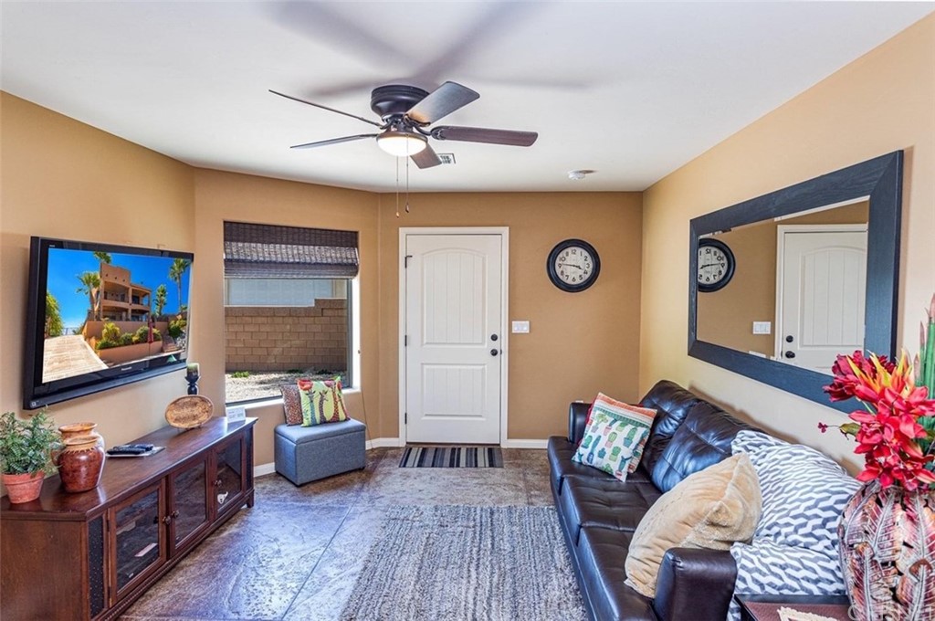 4654 My Place Road Needles, CA 92363 - Photo 55 of 75 a living room with furniture and a flat screen tv