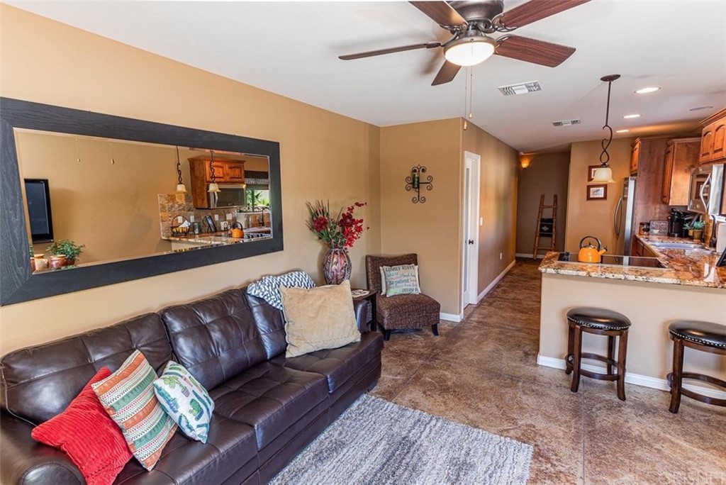 4654 My Place Road Needles, CA 92363 - Photo 75 of 75 a living room with furniture and a flat screen tv