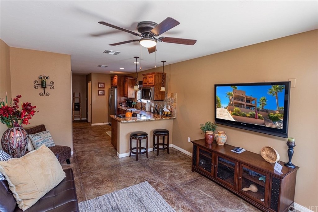 4654 My Place Road Needles, CA 92363 - Photo 56 of 75 a living room with furniture and a flat screen tv