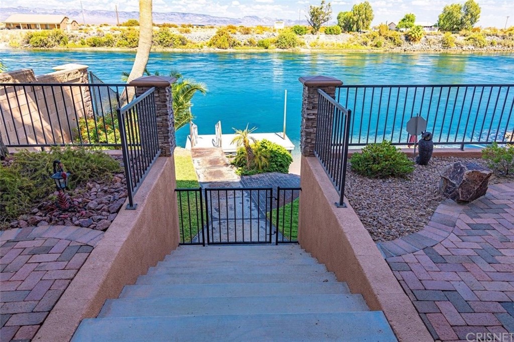 4654 My Place Road Needles, CA 92363 - Photo 6 of 75 Gated walkway down to private dock and frontyard with beautiful landscaping