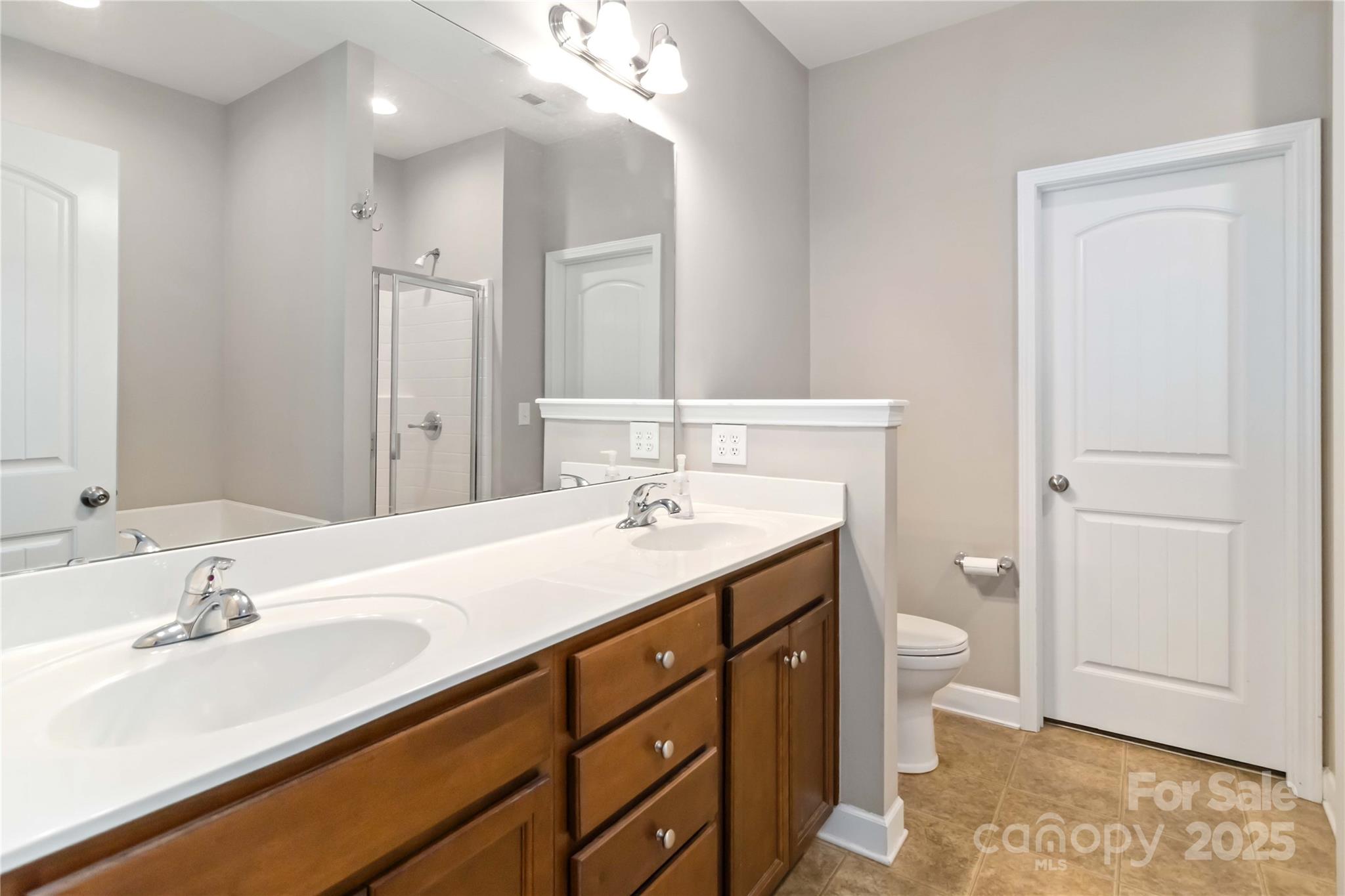 490 Clouds Way Rock Hill, SC 29732 - Photo 26 of 29 a bathroom with a sink double vanity and a mirror