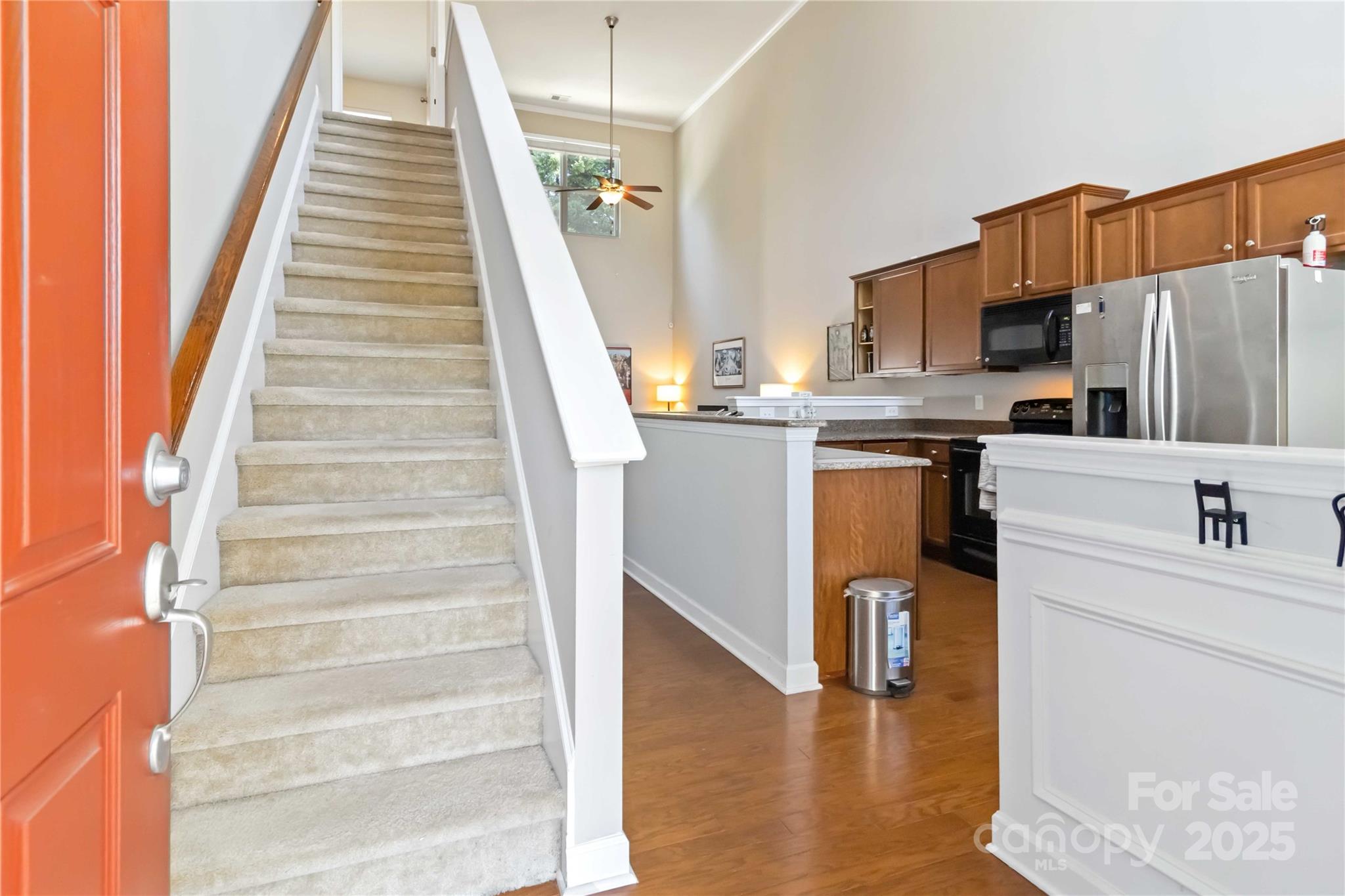 490 Clouds Way Rock Hill, SC 29732 - Photo 6 of 29 a kitchen with stainless steel appliances kitchen island wooden cabinets and entryway