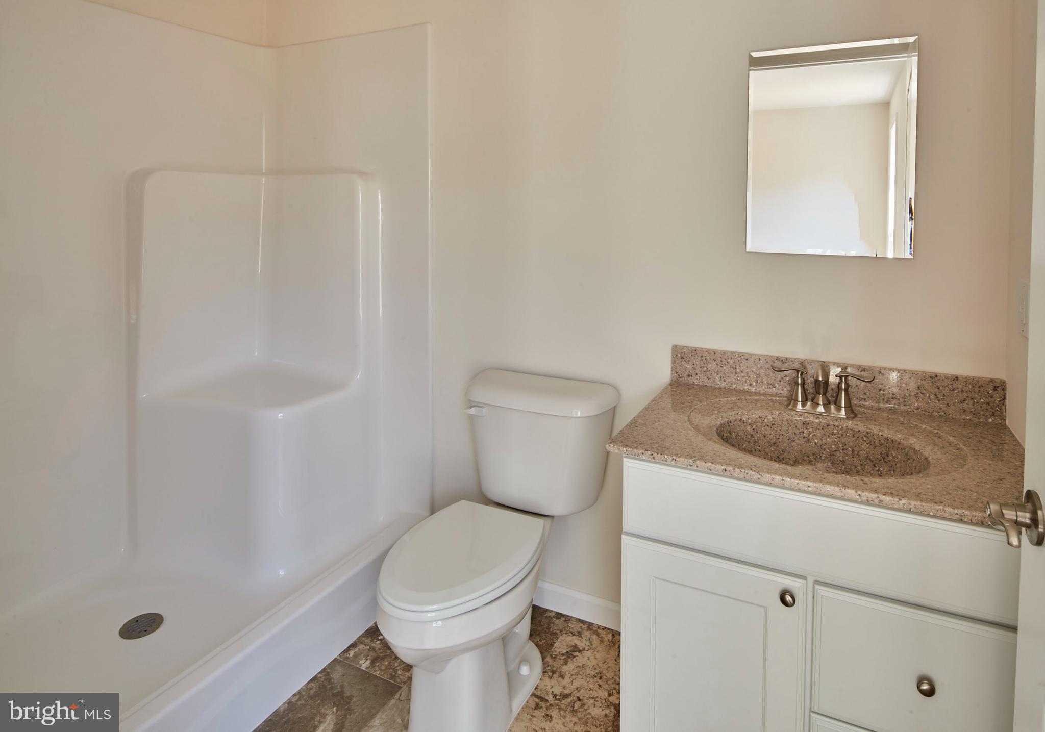 192 Timberwood Trail Centre Hall, PA 16828 - Photo 12 of 20 a bathroom with a granite countertop sink toilet and shower