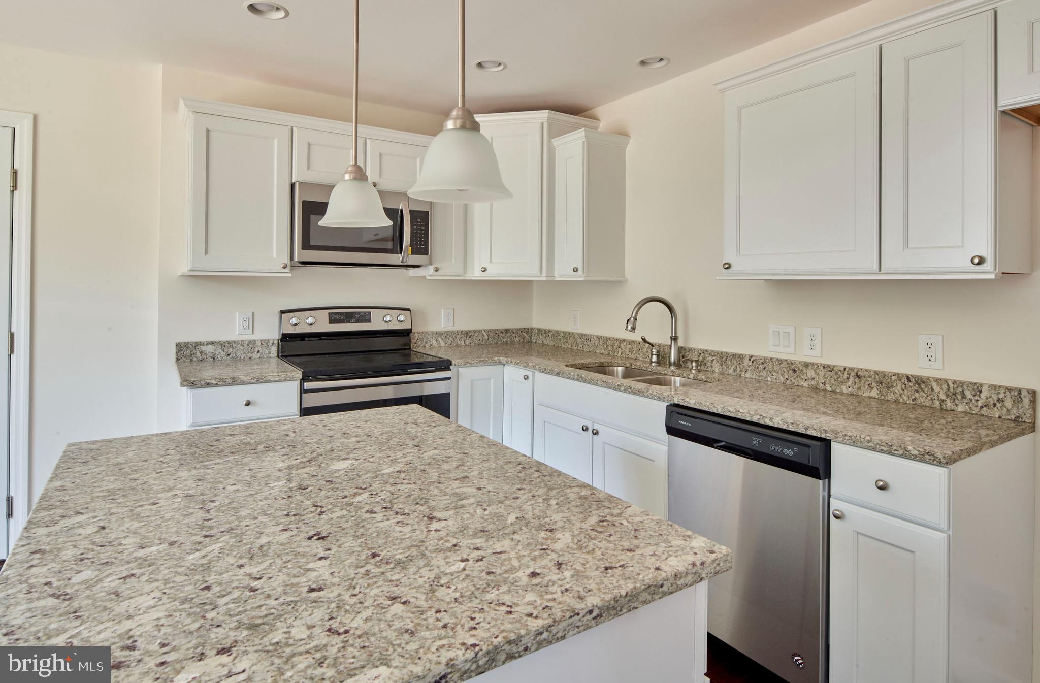 192 Timberwood Trail Centre Hall, PA 16828 - Photo 7 of 20 a kitchen with stainless steel appliances granite countertop a sink stove and refrigerator