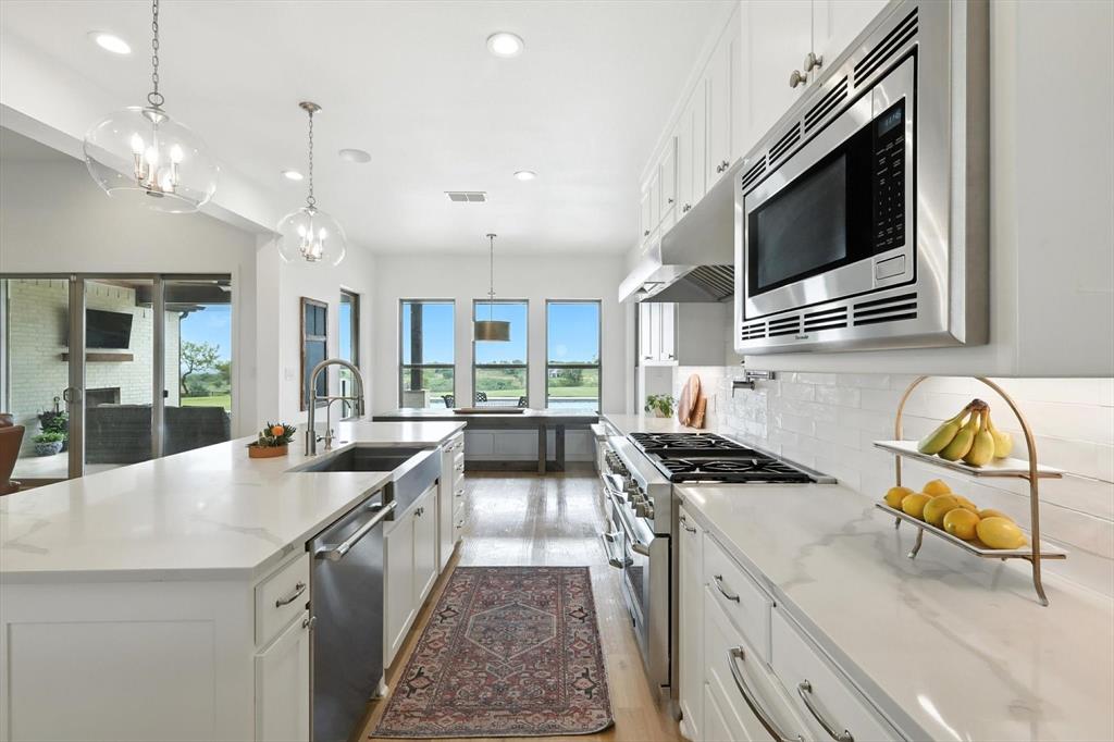 148 Overlook Drive Aledo, TX 76008 - Photo 16 of 40 a kitchen with counter top space appliances and cabinets