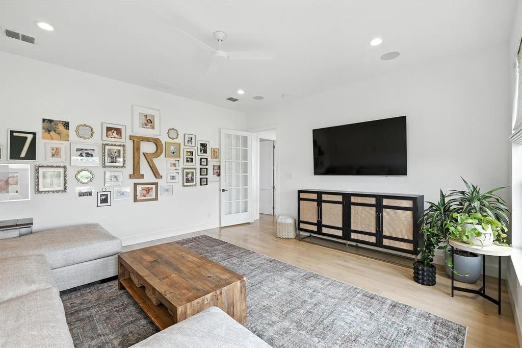 148 Overlook Drive Aledo, TX 76008 - Photo 24 of 40 a living room with furniture and a flat screen tv
