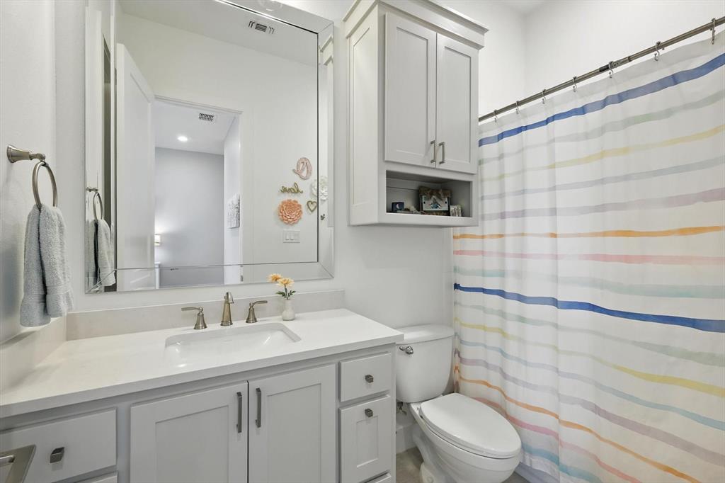 148 Overlook Drive Aledo, TX 76008 - Photo 28 of 40 a bathroom with a sink a toilet and shower