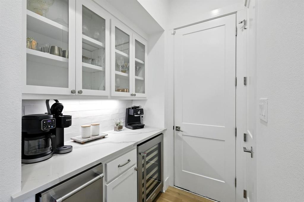 148 Overlook Drive Aledo, TX 76008 - Photo 31 of 40 a kitchen with a refrigerator and cabinets
