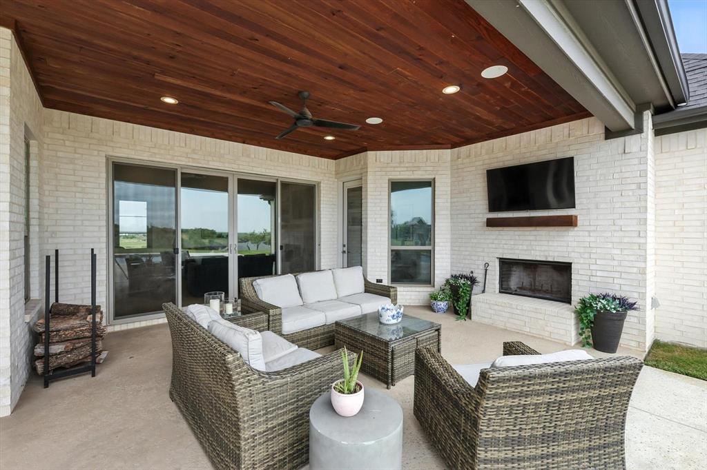 148 Overlook Drive Aledo, TX 76008 - Photo 33 of 40 a outdoor living space with furniture and a fireplace