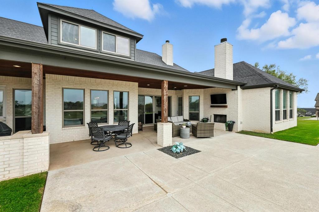 148 Overlook Drive Aledo, TX 76008 - Photo 36 of 40 a group of people sitting in front of a house