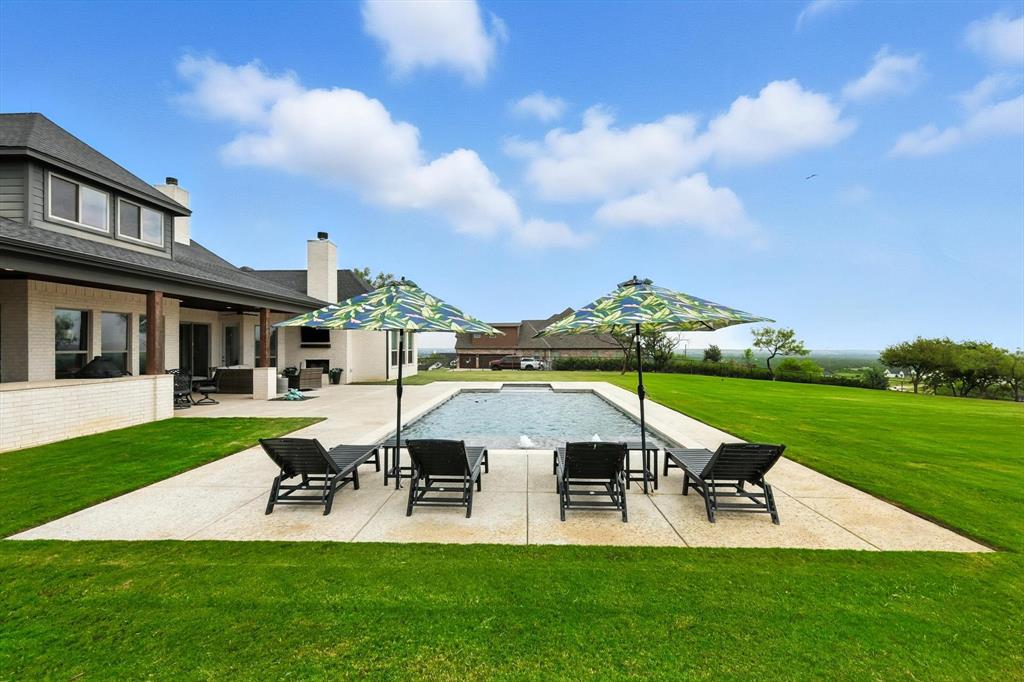 148 Overlook Drive Aledo, TX 76008 - Photo 38 of 40 a view of a house with swimming pool and chairs