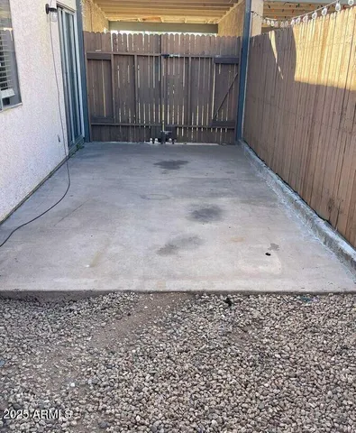 a view of a terrace with a lawn chairs