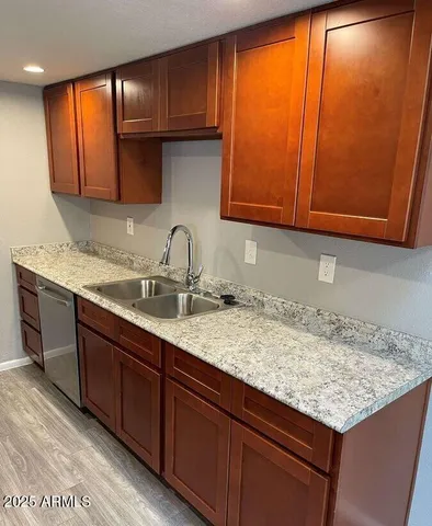 a kitchen with sink and cabinets