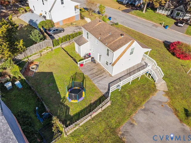 an aerial view of a house with a swimming pool