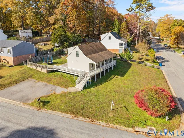 an aerial view of residential houses with outdoor space