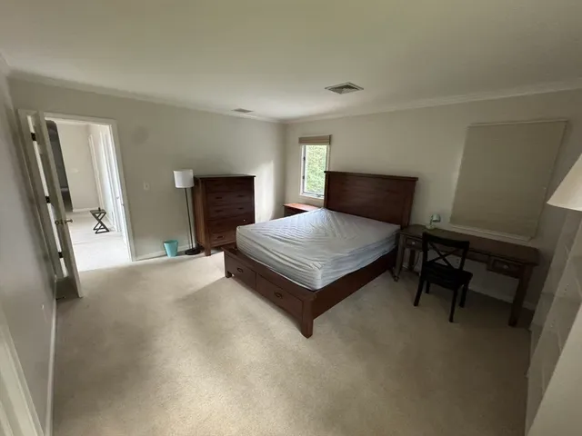 a bathroom with a sink a toilet a mirror and bathtub