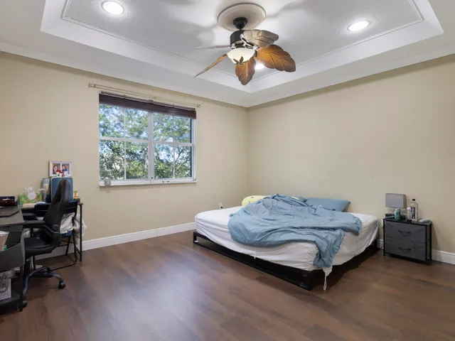 a bedroom with a bed and a chair