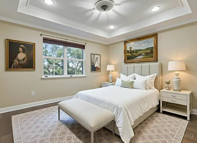 a bedroom with a bed and a painting on the wall