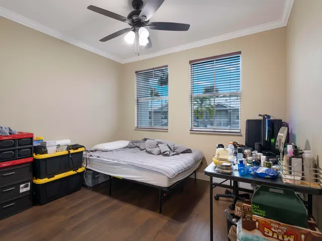 a bedroom with a workspace