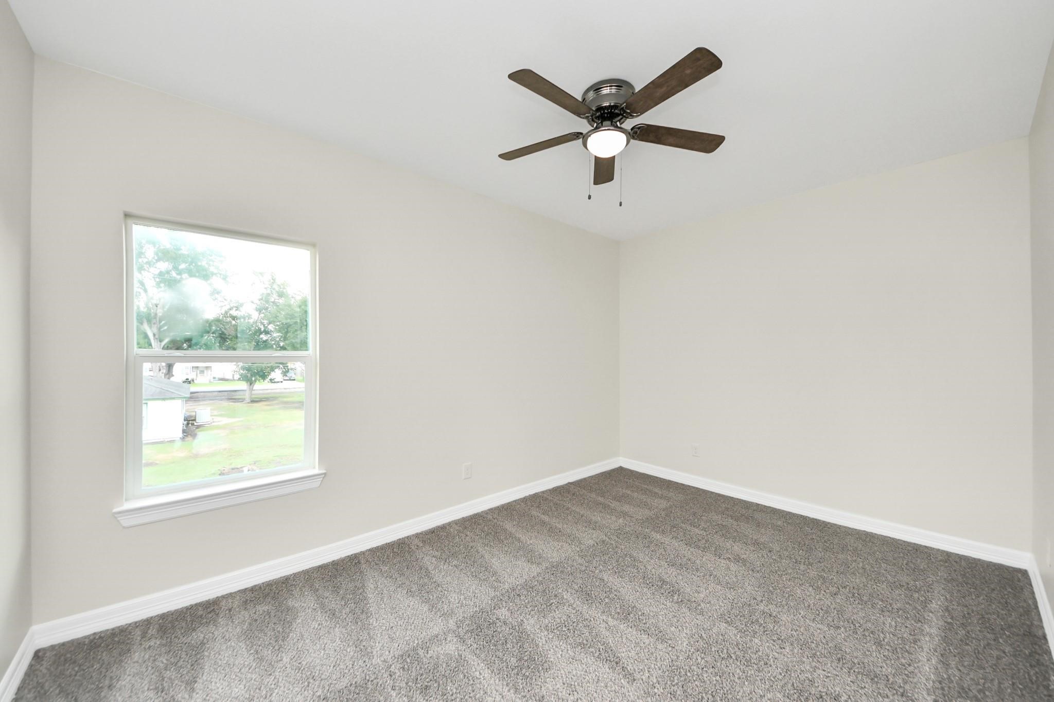 422 North 4th Street Beasley, TX 77417 - Photo 21 of 30 an empty room with a window