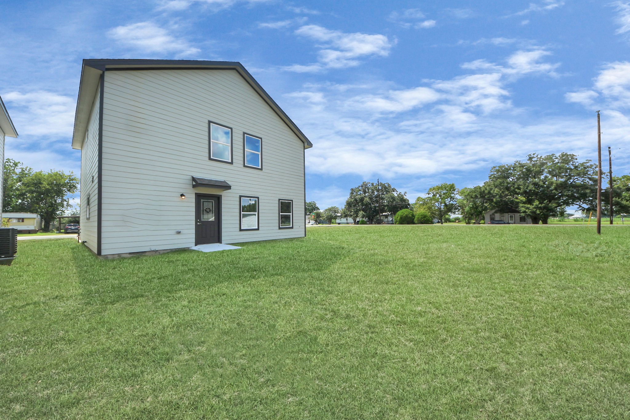 422 North 4th Street Beasley, TX 77417 - Photo 25 of 30 a view of a backyard with large trees