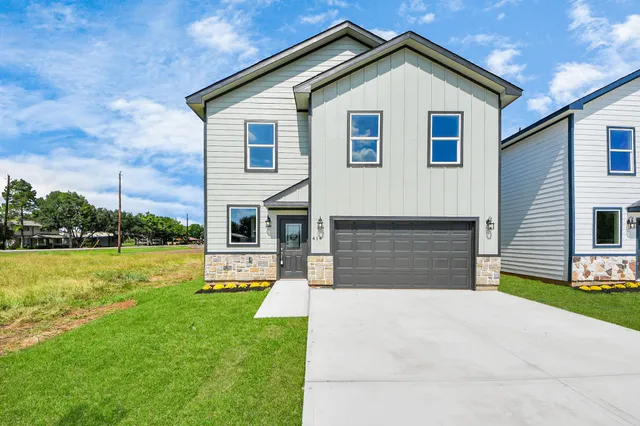 a front view of house with yard