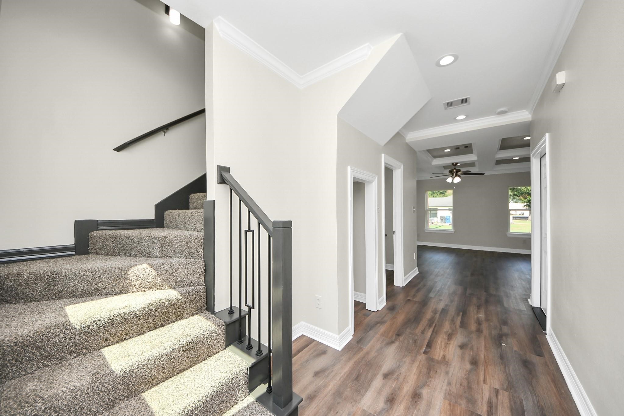 422 North 4th Street Beasley, TX 77417 - Photo 4 of 30 a view of a hallway with wooden floor and staircase