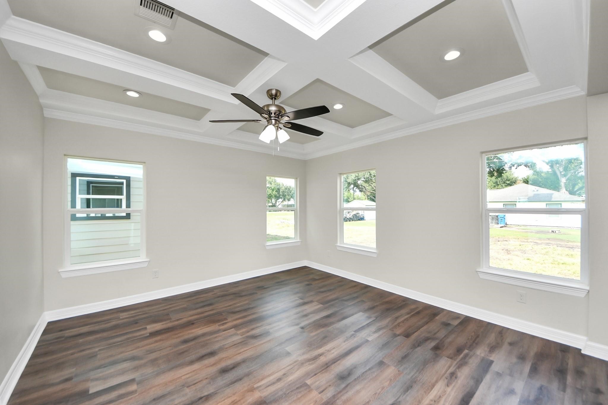 422 North 4th Street Beasley, TX 77417 - Photo 5 of 30 a view of an empty room with wooden floor and a window