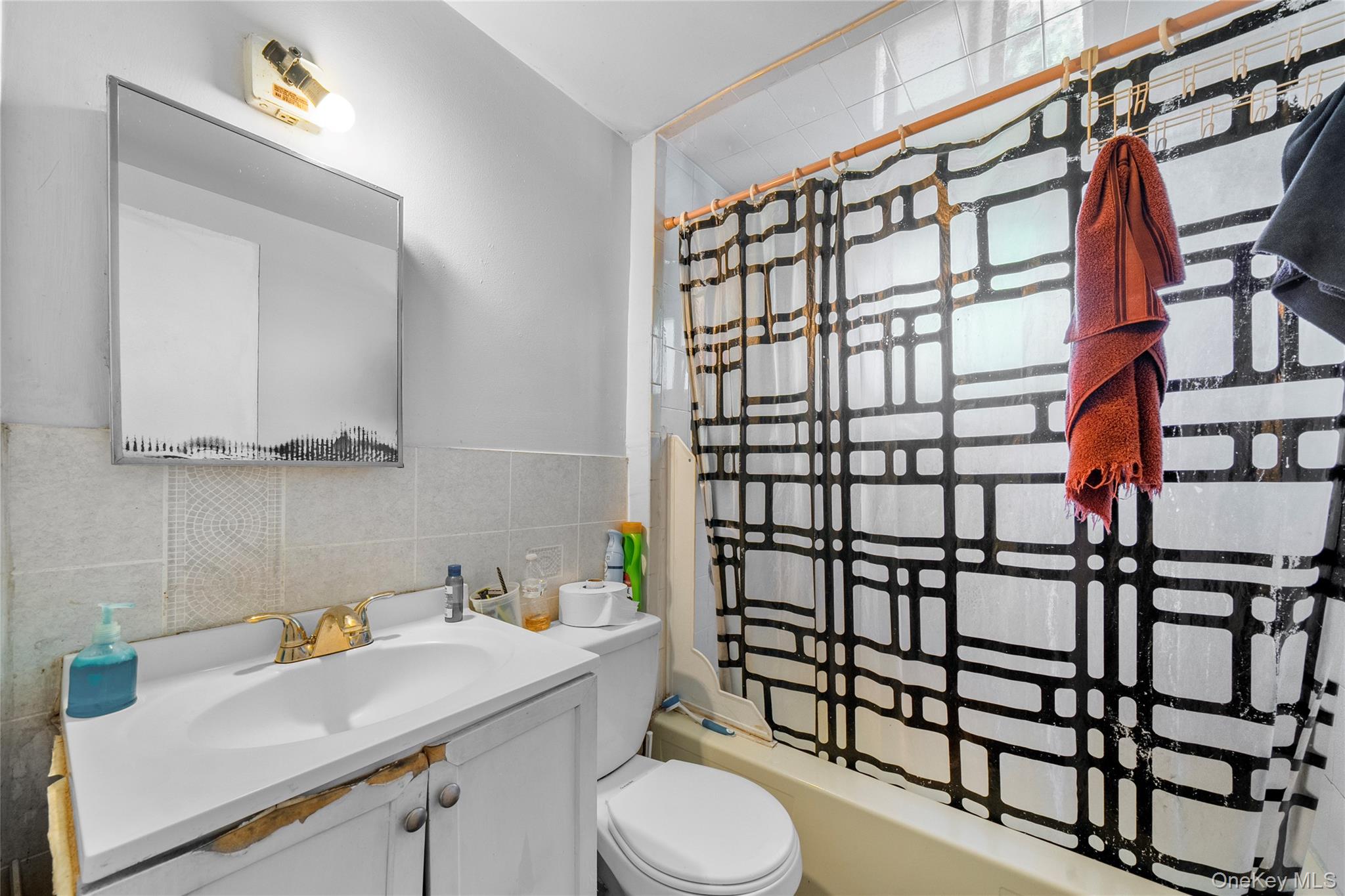 1739 Harrison Avenue Bay Shore, NY 11706 - Photo 11 of 15 a bathroom with a sink toilet and shower