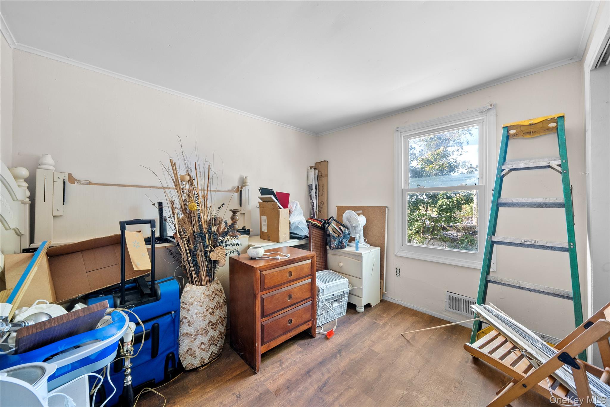 1739 Harrison Avenue Bay Shore, NY 11706 - Photo 12 of 15 a bed room with a bed and a window