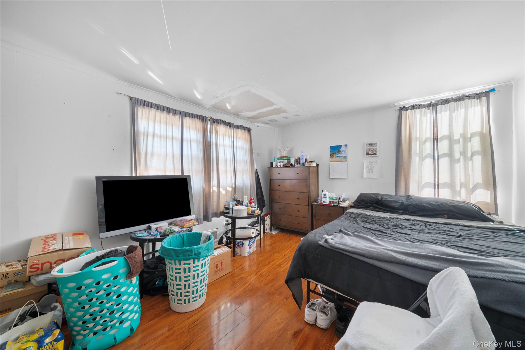 1739 Harrison Avenue Bay Shore, NY 11706 - Photo 13 of 15 a bedroom with furniture and a flat screen tv