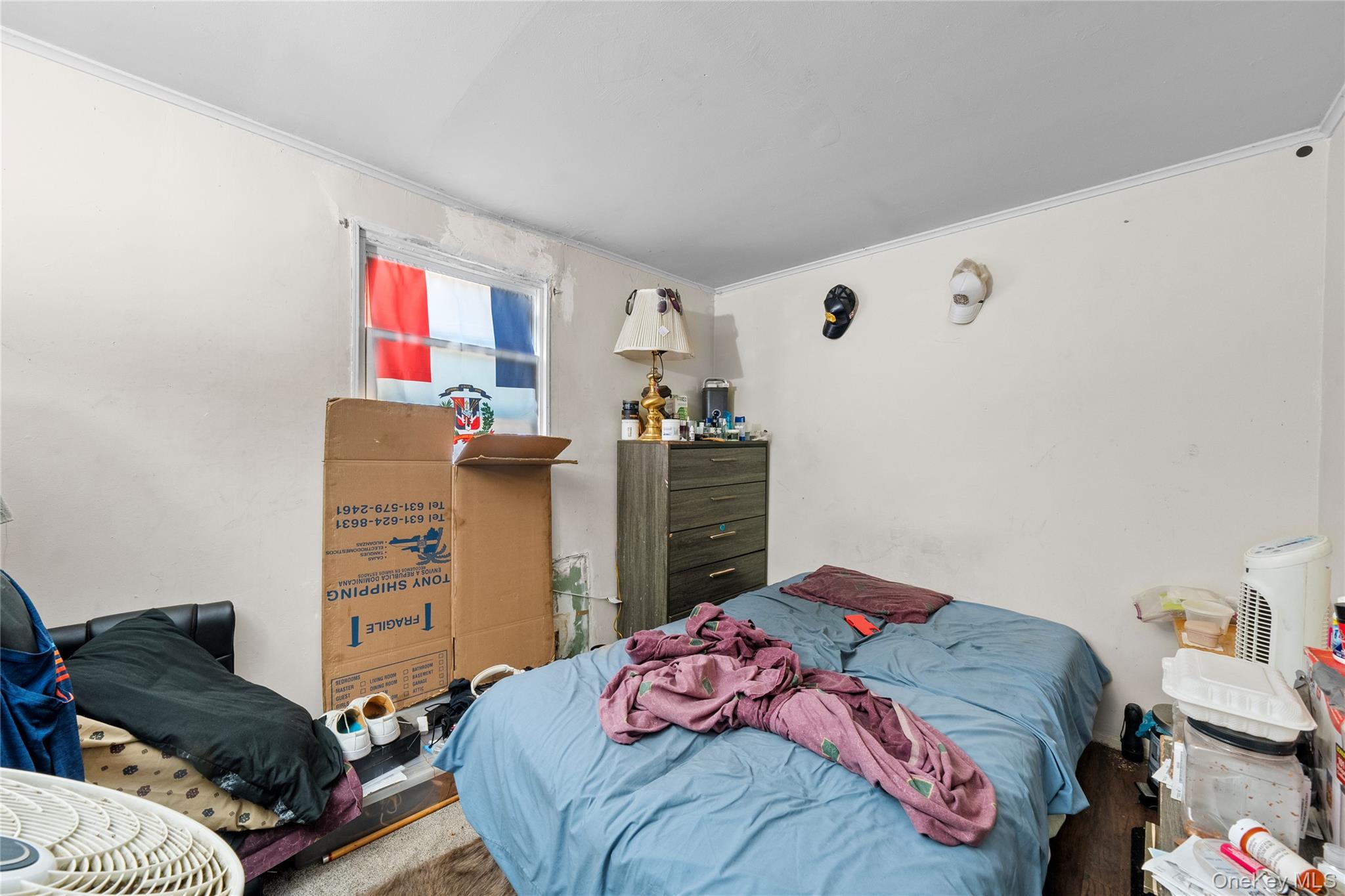 1739 Harrison Avenue Bay Shore, NY 11706 - Photo 14 of 15 a bedroom with a bed and a couch