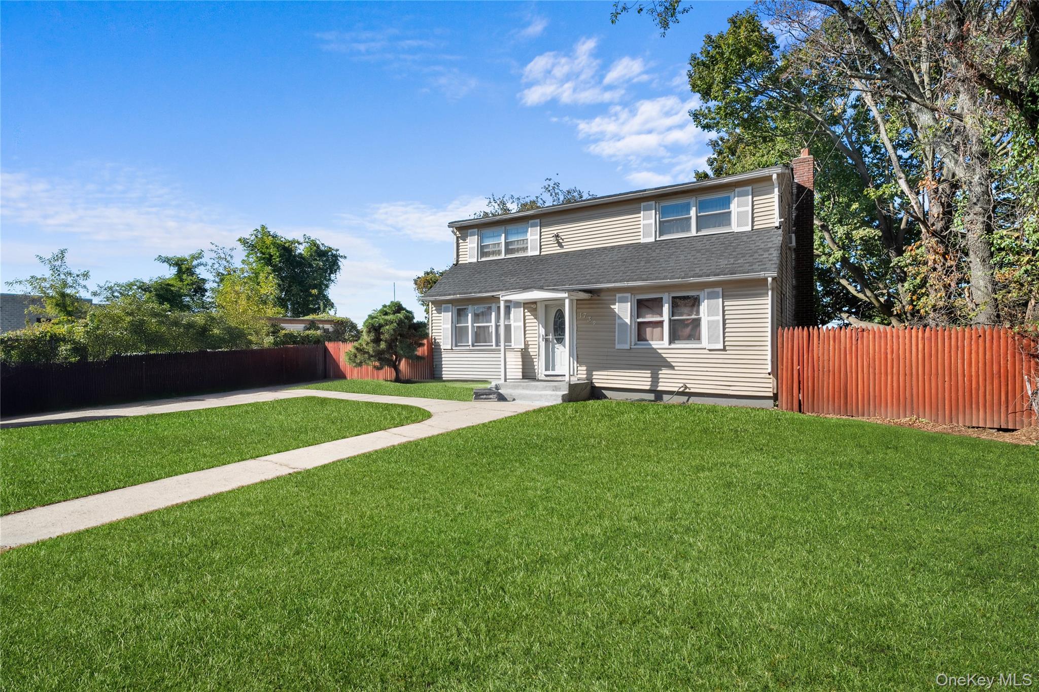 1739 Harrison Avenue Bay Shore, NY 11706 - Photo 2 of 15 a front view of house with yard and green space