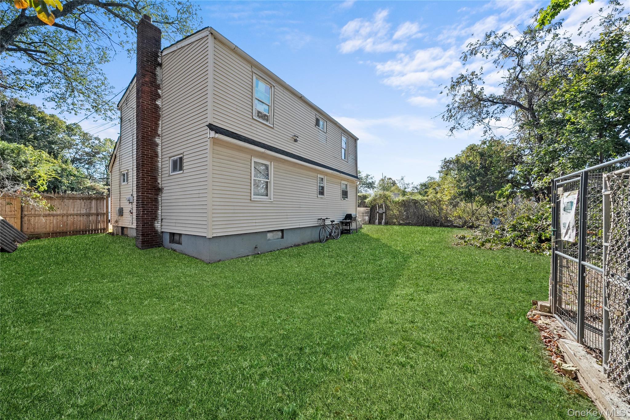1739 Harrison Avenue Bay Shore, NY 11706 - Photo 5 of 15 a view of a back yard of the house