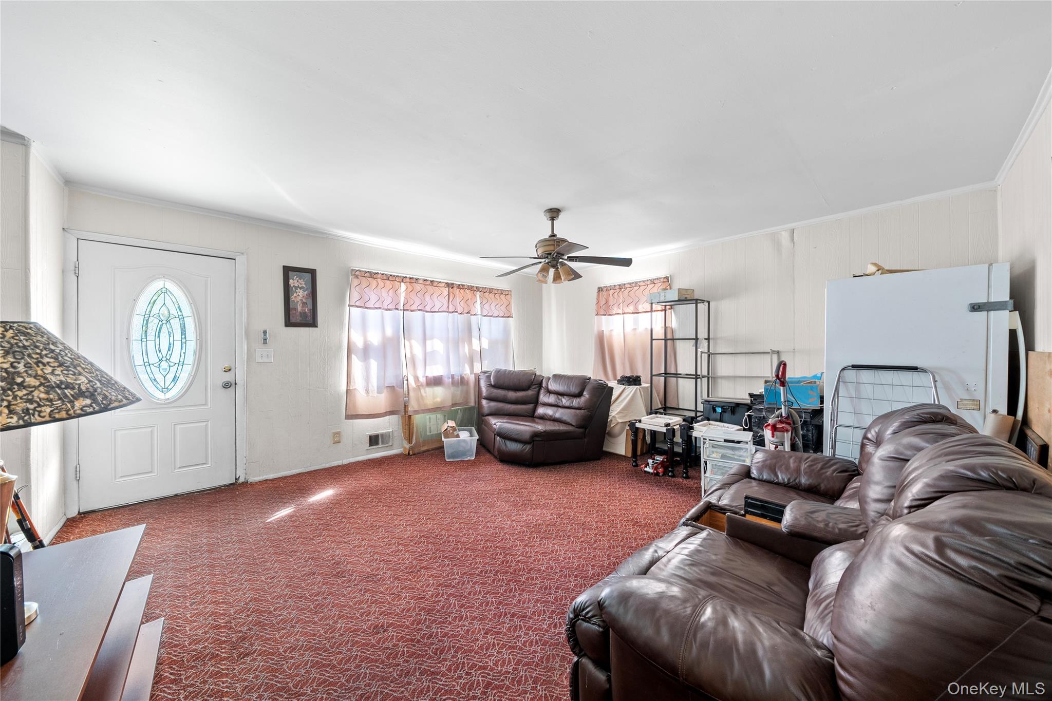 1739 Harrison Avenue Bay Shore, NY 11706 - Photo 6 of 15 a living room with furniture and a large window