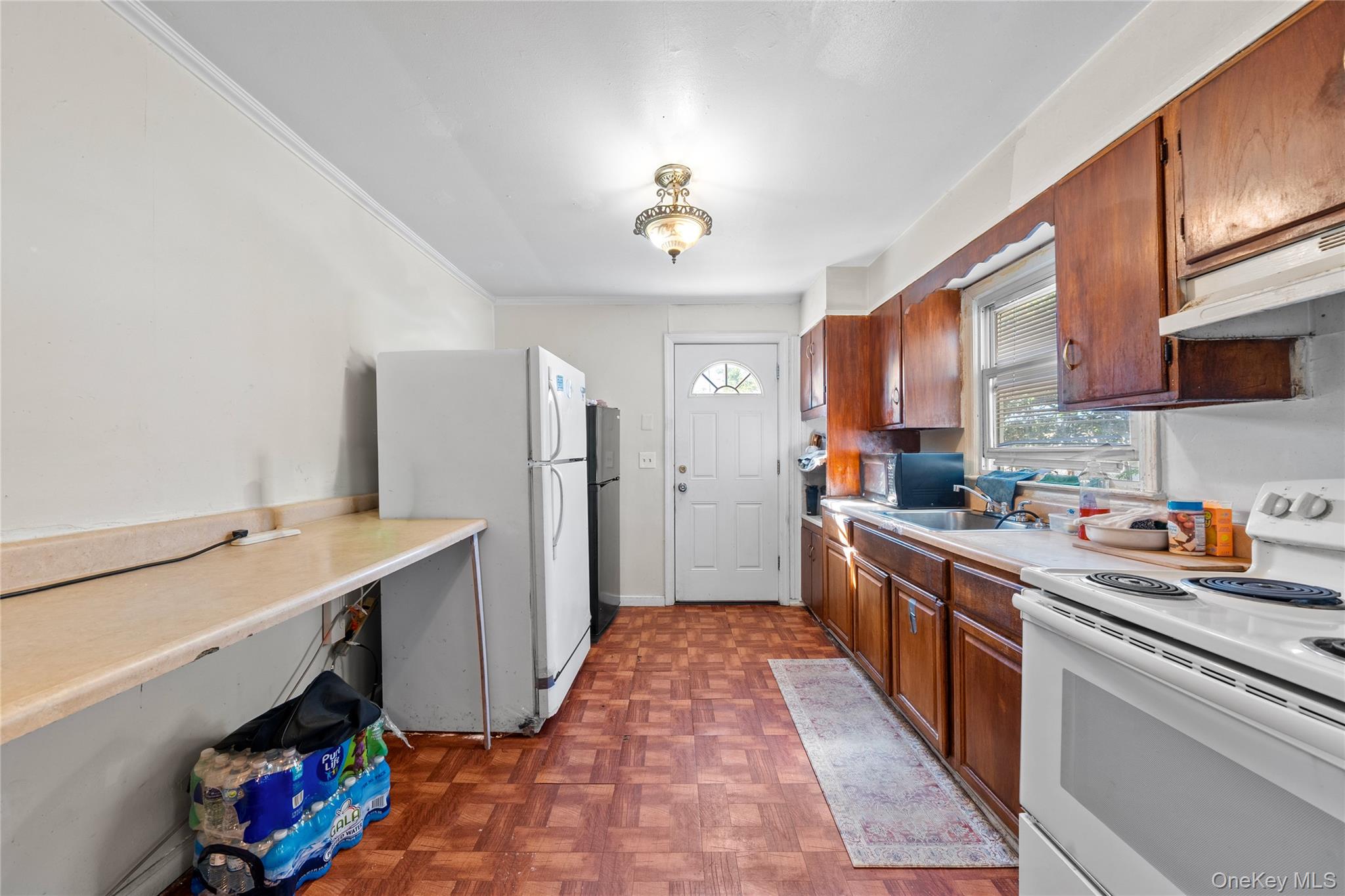 1739 Harrison Avenue Bay Shore, NY 11706 - Photo 7 of 15 a kitchen that has a lot of cabinets in it and appliances