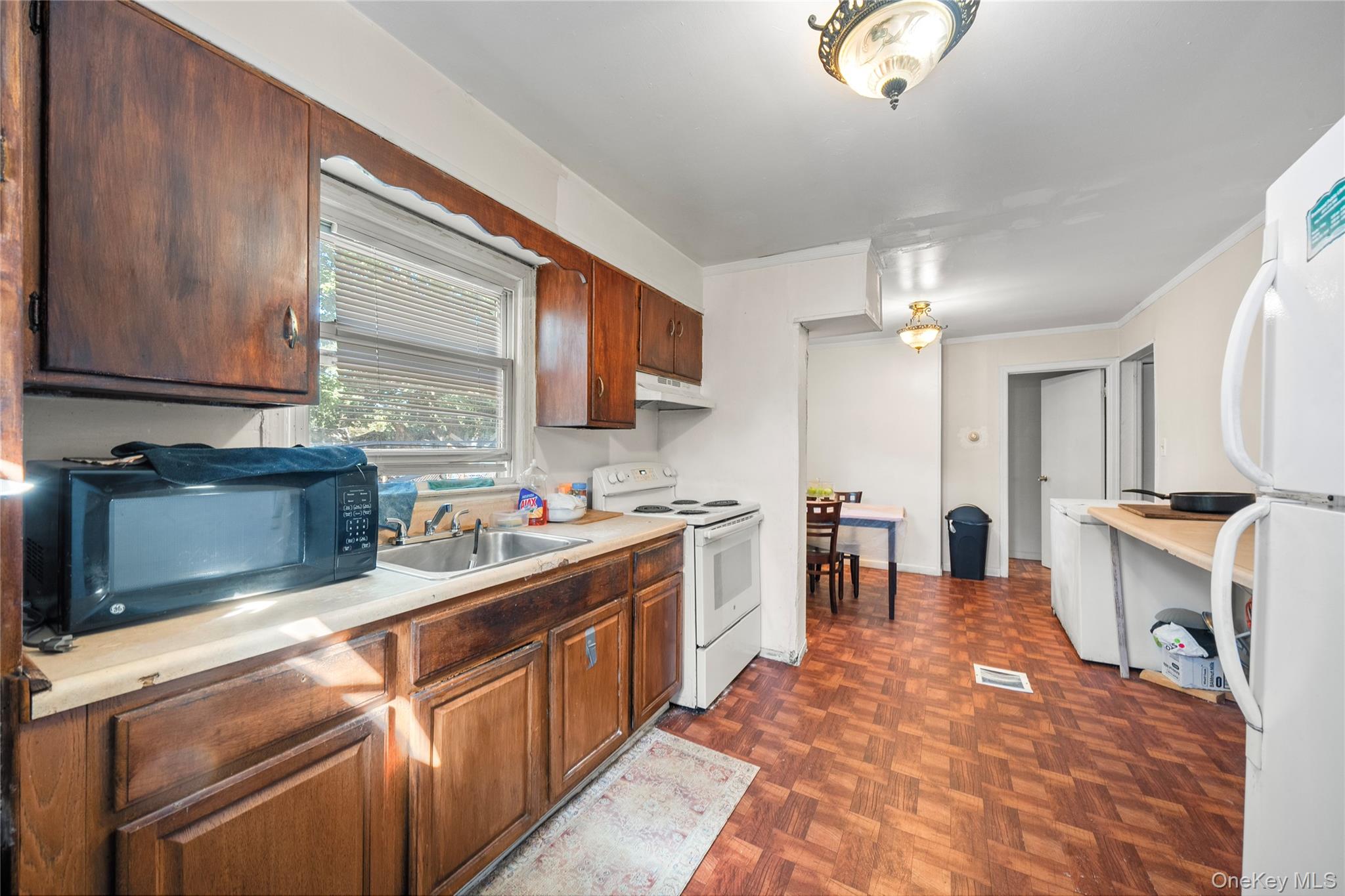 1739 Harrison Avenue Bay Shore, NY 11706 - Photo 8 of 15 a kitchen with stainless steel appliances granite countertop a sink stove and cabinets