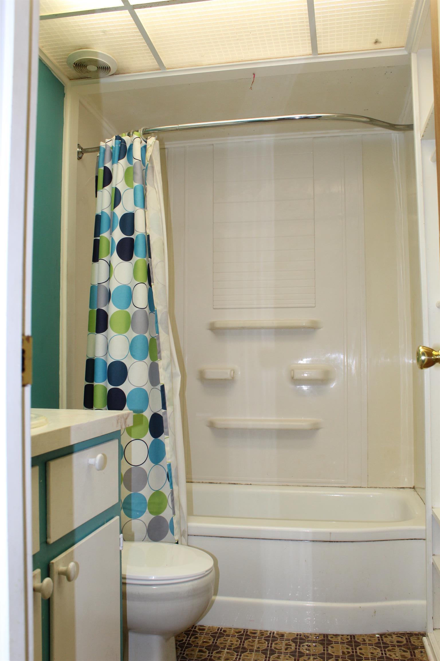 932 CCC Road McEwen, TN 37101 - Photo 13 of 30 a bathroom with a toilet and a shower