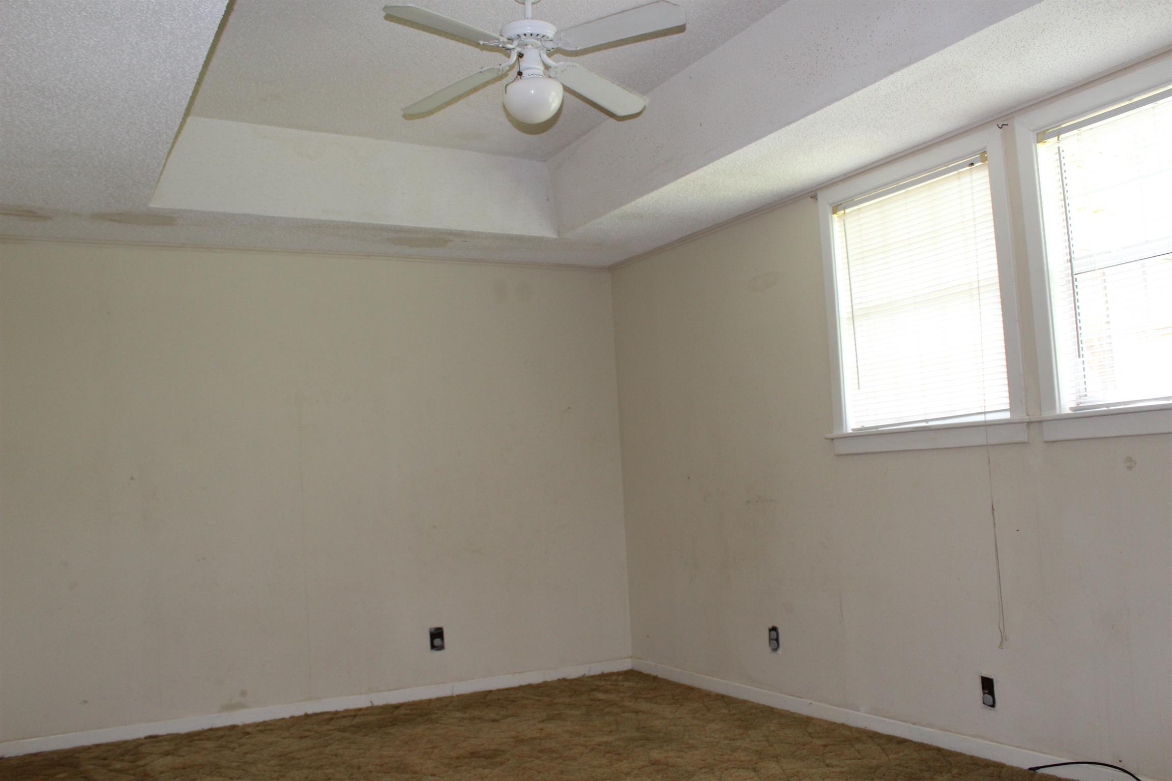 932 CCC Road McEwen, TN 37101 - Photo 14 of 30 an empty room with a window and a fan