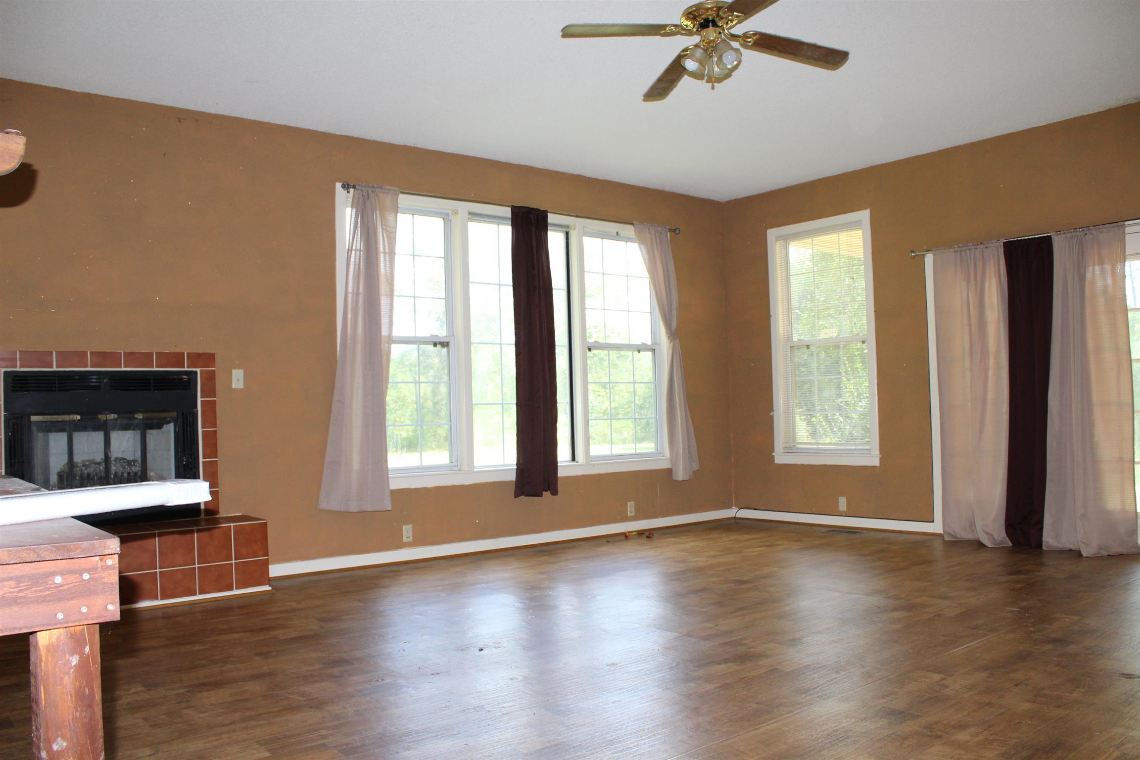 932 CCC Road McEwen, TN 37101 - Photo 6 of 30 a view of a livingroom with wooden floor and a window