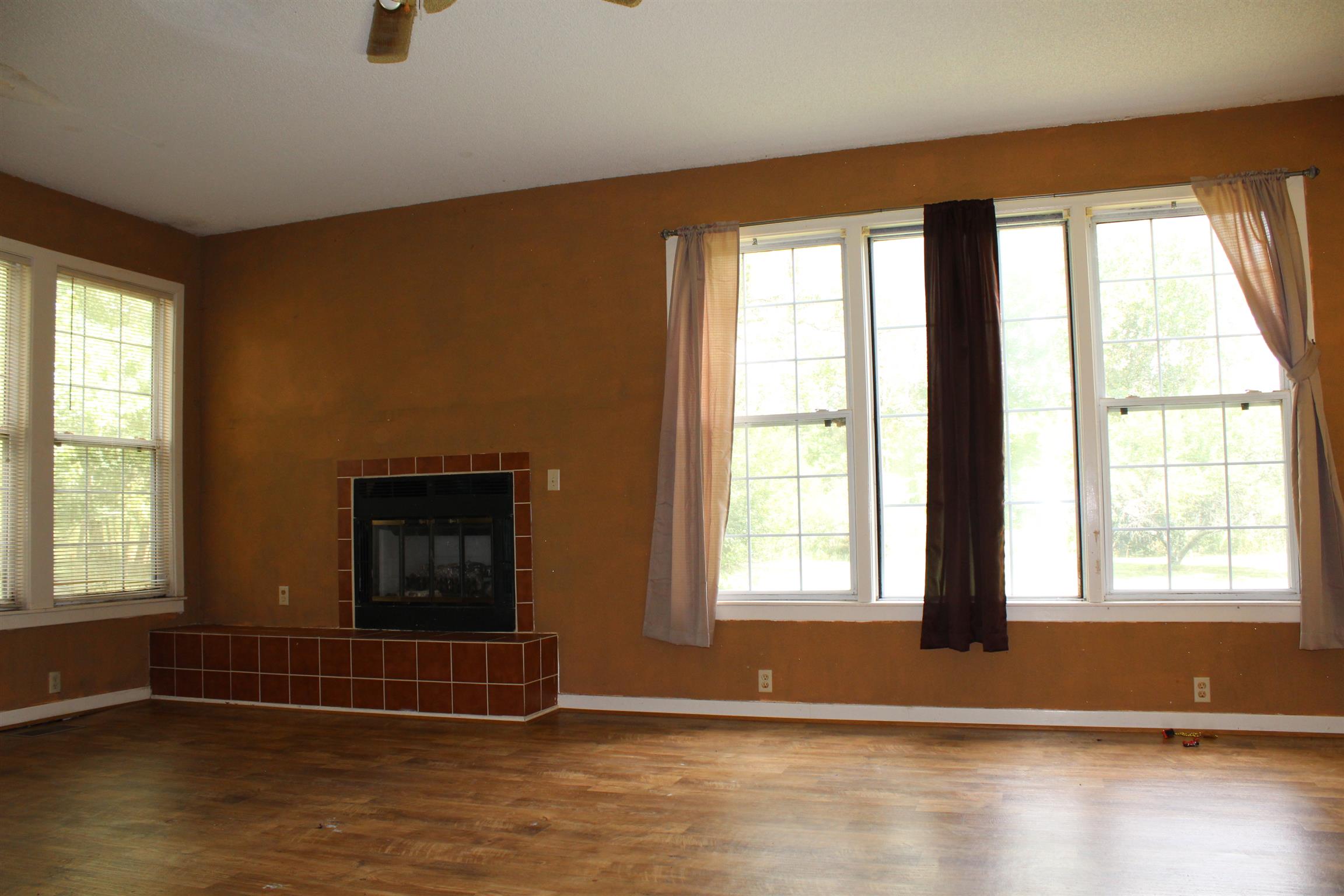 932 CCC Road McEwen, TN 37101 - Photo 7 of 30 a view of empty room with wooden floor and fan