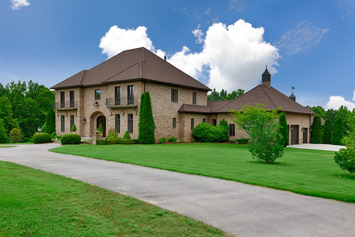 7195 Barker Road Athens, AL 35614 - Photo 1 of 49 a front view of a house with garden