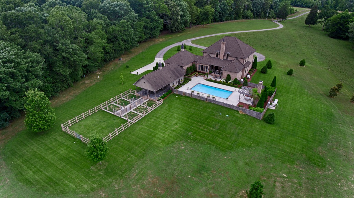 7195 Barker Road Athens, AL 35614 - Photo 16 of 49 an aerial view of a house with a garden and swimming pool